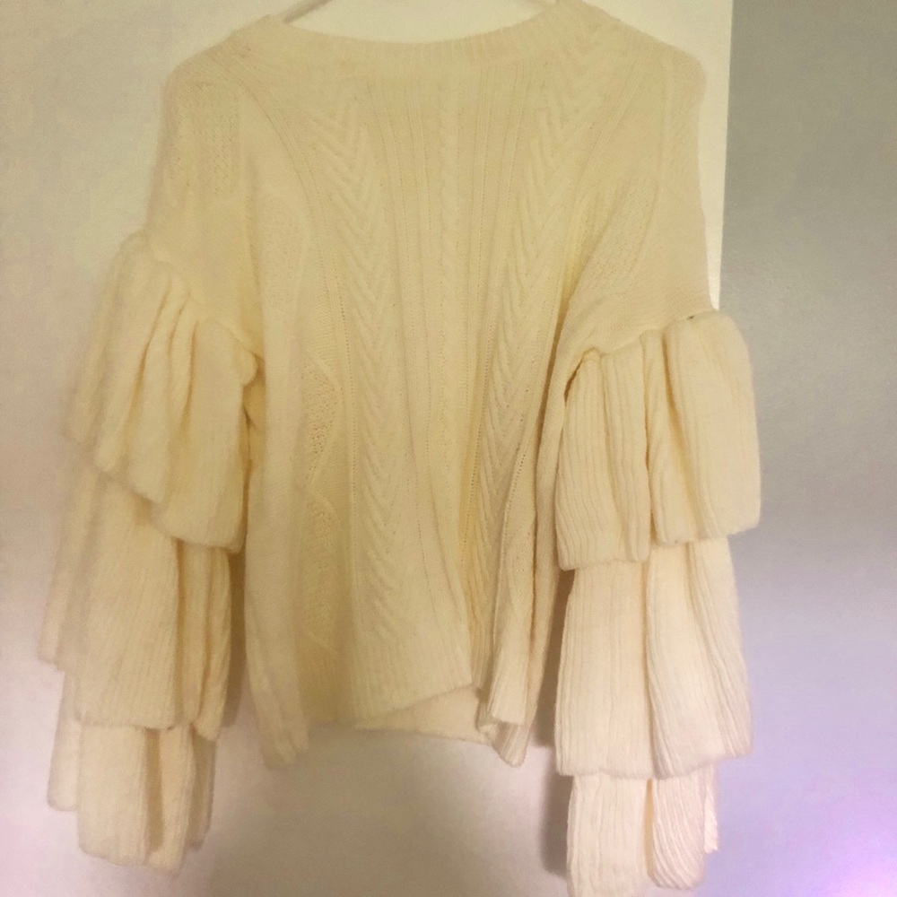 Cream sweater with ruffled sleeves